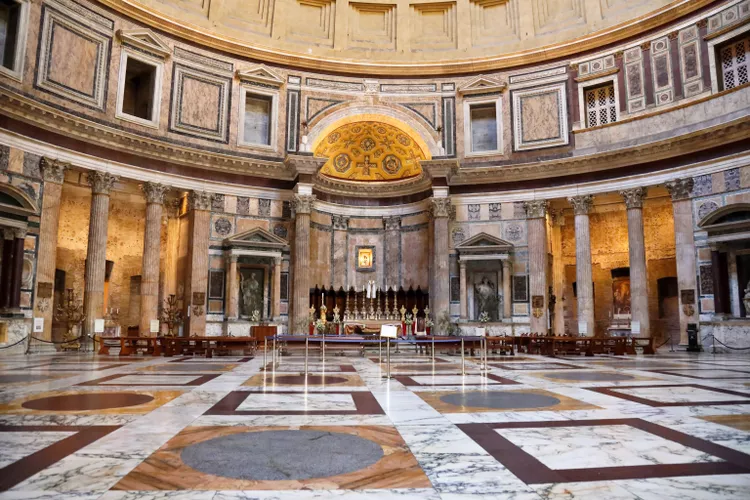 Interior of the Pantheon in Rome showing the coffered dome, marble floor and altar